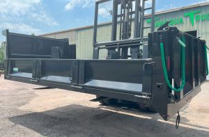 Mason dump body, painted black, with fold down sides and air operated tailgate.